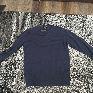 Blue sweater, casual setting